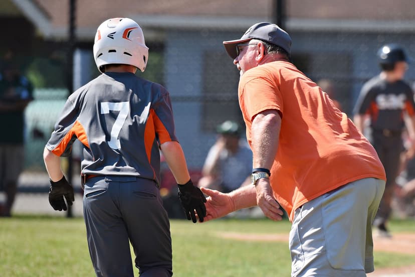 Coach giving high fives to players