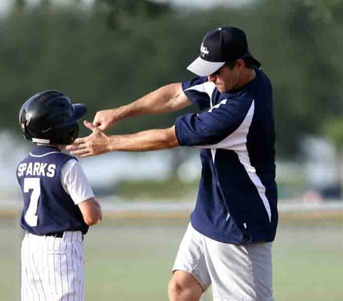 Coach teaching batting stance