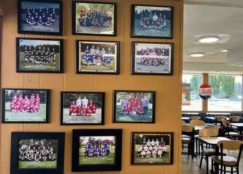 Youth baseball and softball teams with their coaches